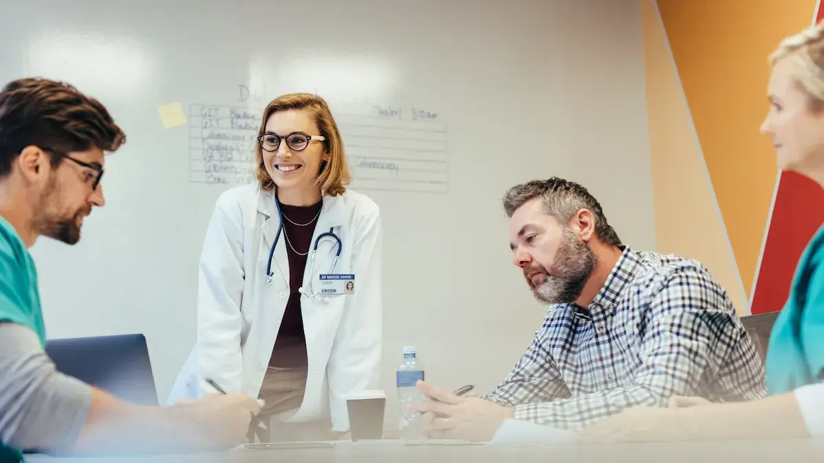 A group of healthcare professionals in a meeting.