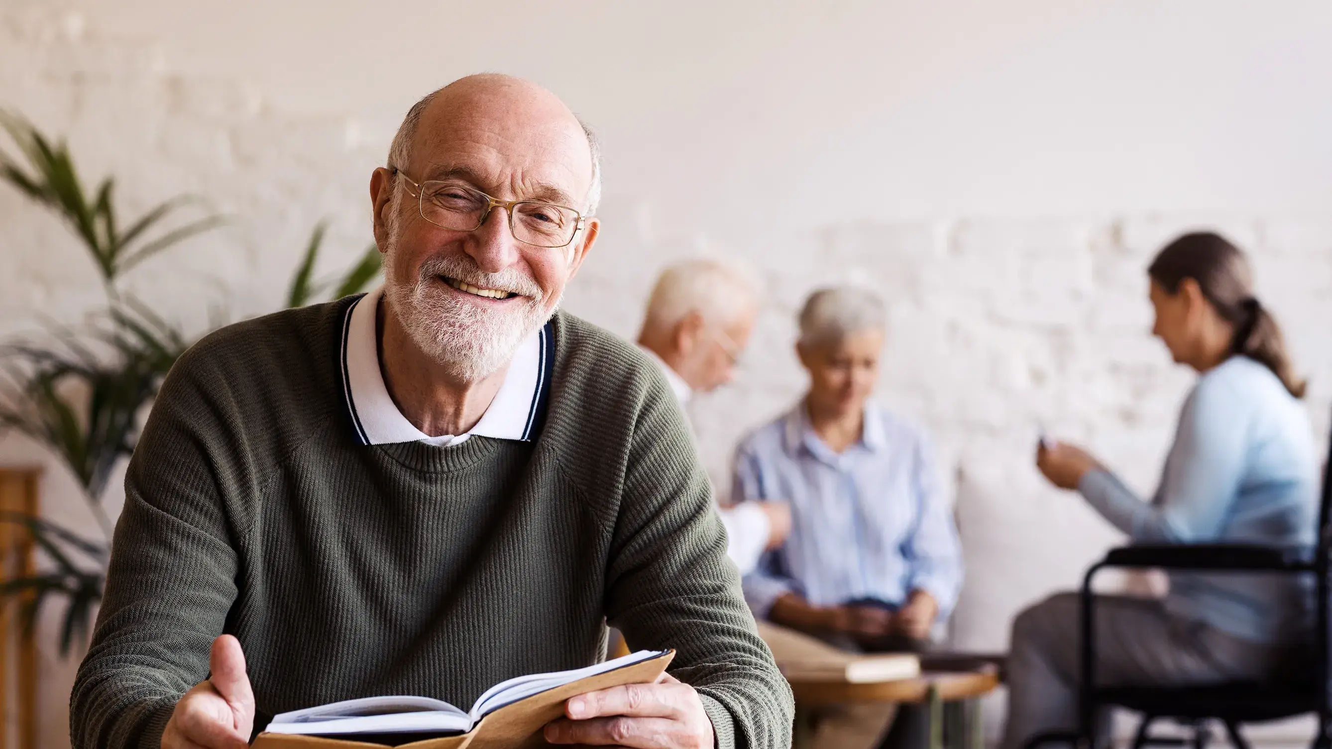 group of four older adults learning together in a cozy room setting