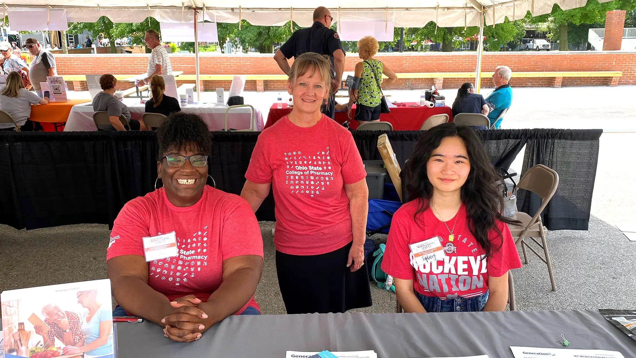 Three GenerationRx ambassadors at an outreach event in the community