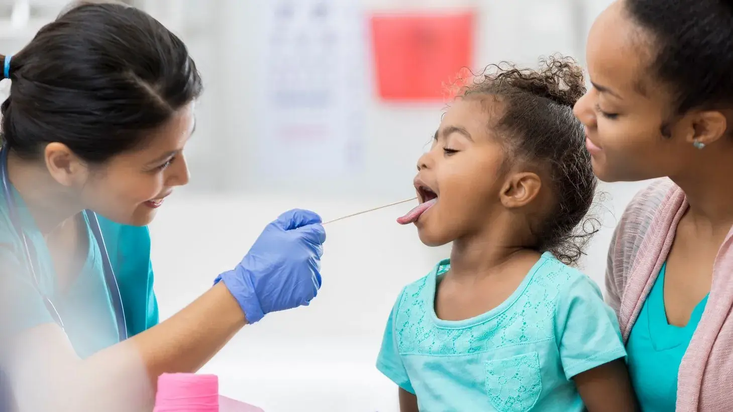 mother with her child during a routine health examination