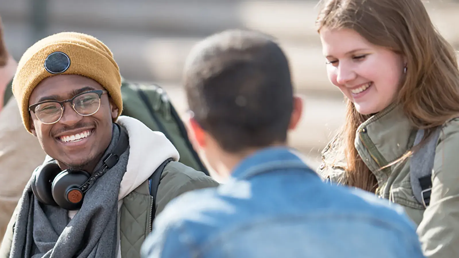 students in a small group smiling 