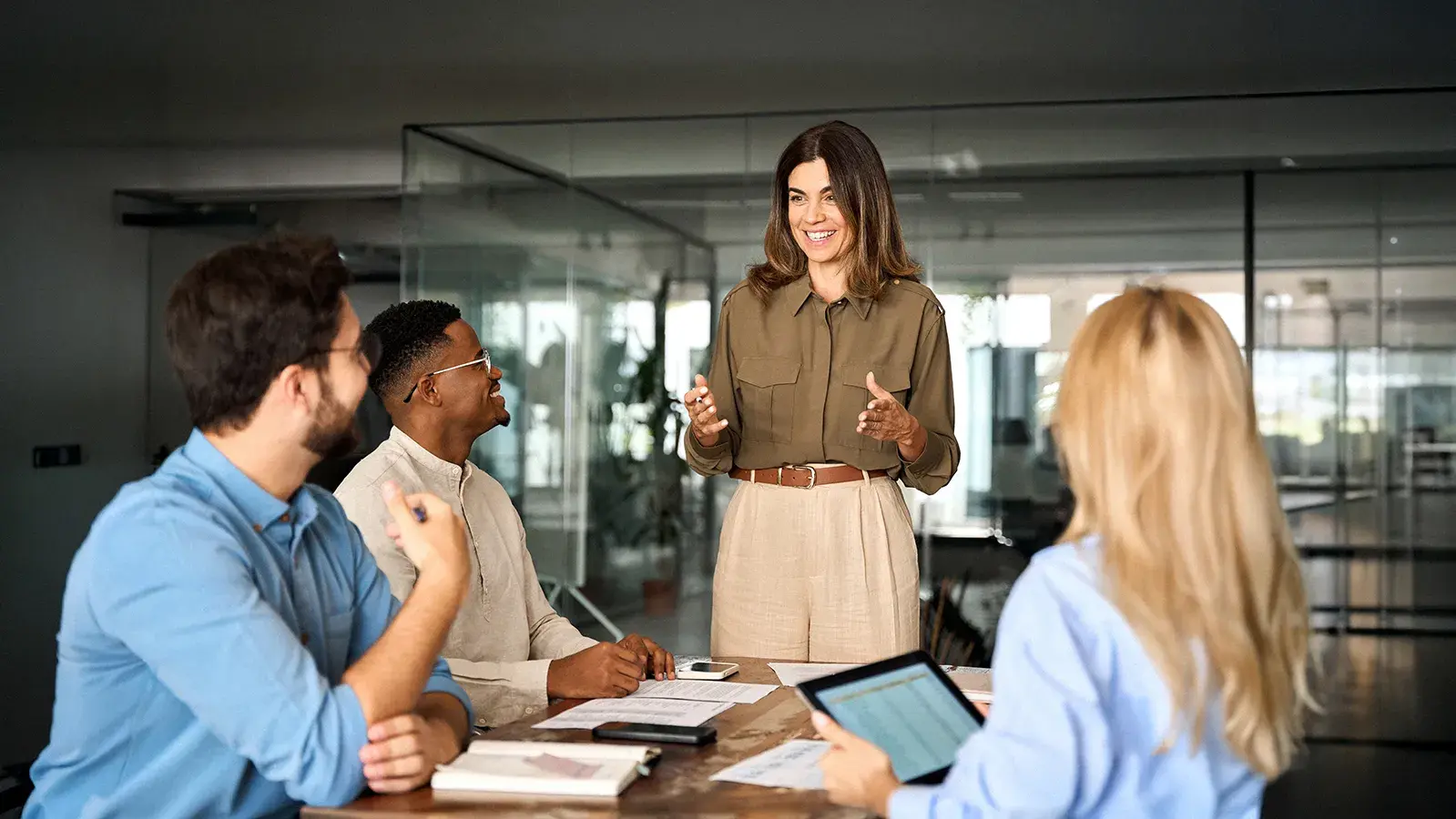 Group of individuals in a board room setting discussing important local topics